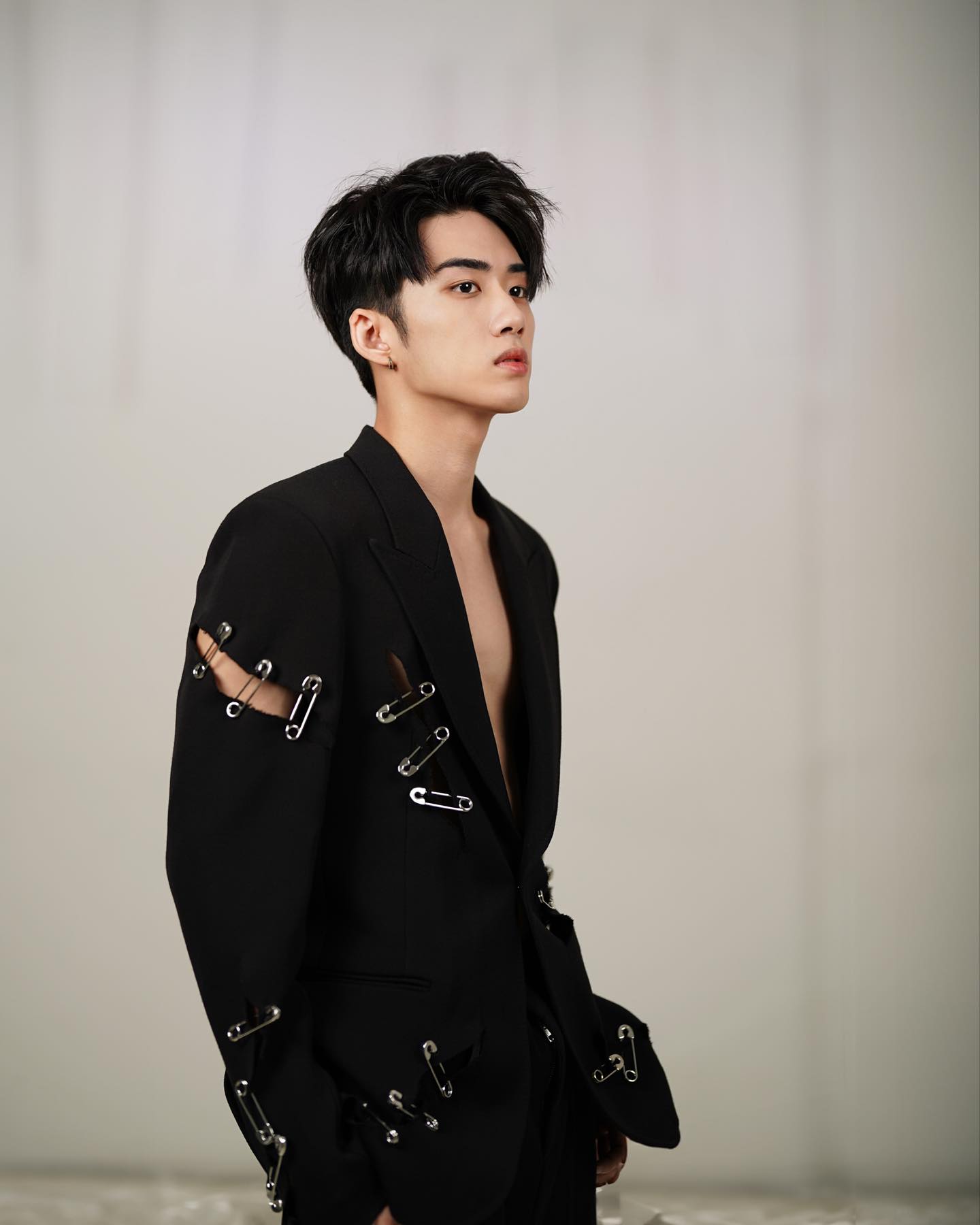 YANG YAN in a black safety-pin jacket