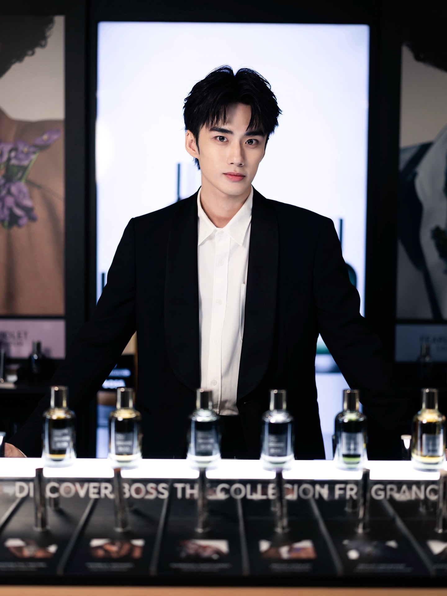 YANG YAN in a black tuxedo at a fragrance boutique event