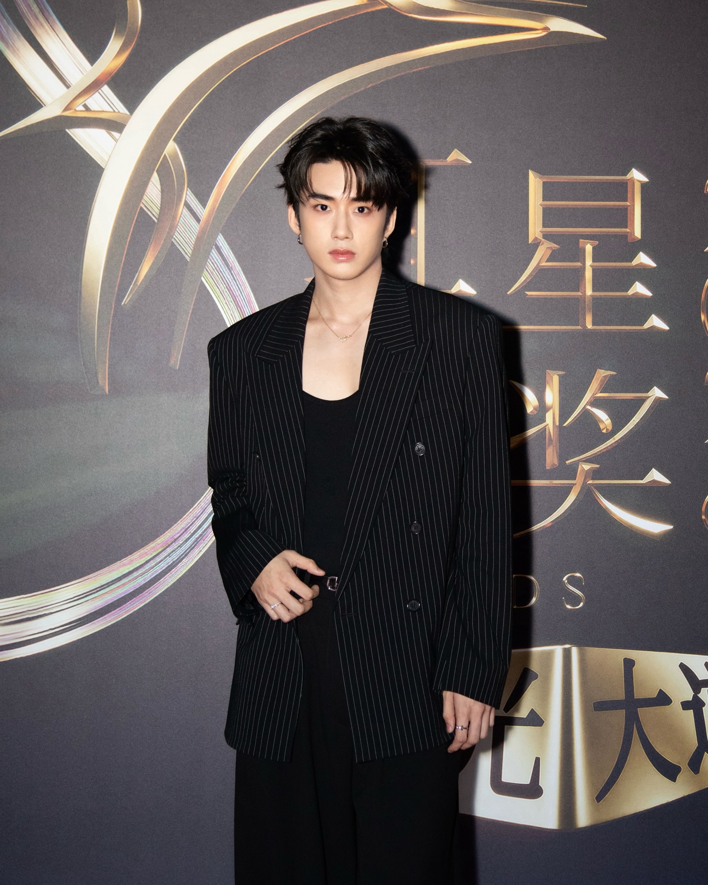 YANG YAN on a red carpet in a pinstripe blazer at an awards show
