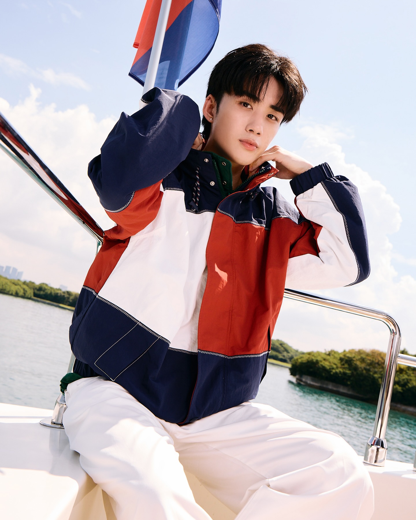 YANG YAN in a colour-block sailing jacket on a boat